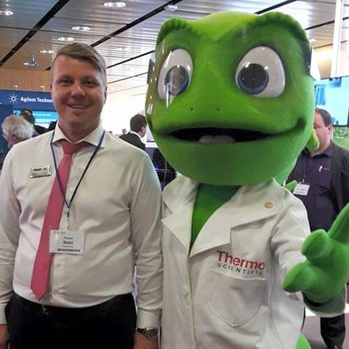 Florian Stahl standing with a Thermo Scientific's frog mascot