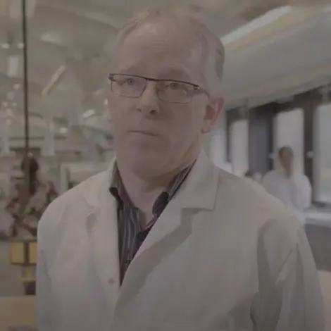 Image of man in a lab coat