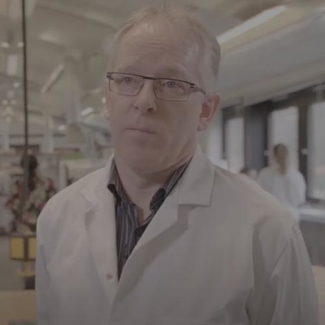 Image of man in a lab coat